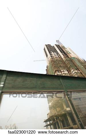 China, Guangdong Province, Guangzhou, high rise under construction View Large Photo Image Stock Image - China, Guangdong Province, Guangzhou, high rise under construction. Fotosearch