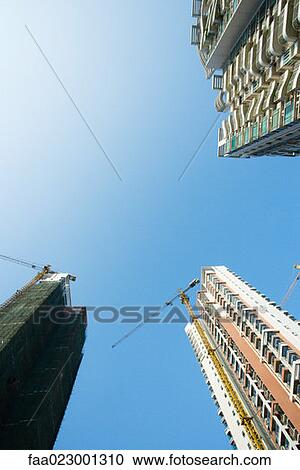 Stock Image - China, Guangdong Province, Guangzhou, high rises under construction. Fotosearch