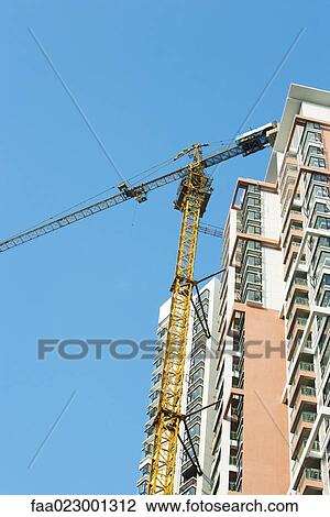 Stock Image - China, Guangdong Province, Guangzhou, high rise under construction. Fotosearch