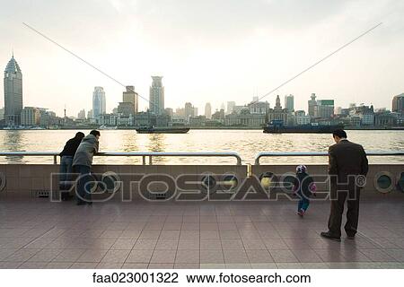 China, Guangdong Province, Guangzhou, people standing on pier, looking at view View Large Photo Image Stock Image - China, Guangdong Province, Guangzhou, people standing on pier, looking at view. Fotosearch