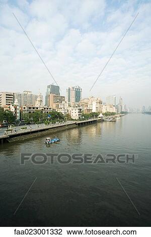 China, Guangdong Province, Guangzhou, cityscape seen from water View Large Photo Image Stock Image - China, Guangdong Province, Guangzhou, cityscape seen from water. Fotosearch
