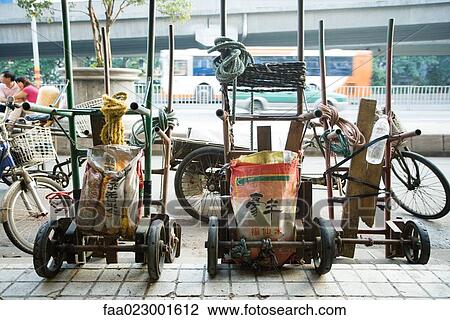 China, Guangdong Province, Guangzhou, carts parked on sidewalk View Large Photo Image Stock Image - China, Guangdong Province, Guangzhou, carts parked on sidewalk. Fotosearch