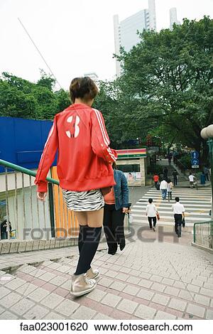 China, Guangdong Province, Guangzhou, people walking up and down stairs View Large Photo Image Stock Image - China, Guangdong Province, Guangzhou, people walking up and down stairs. Fotosearch