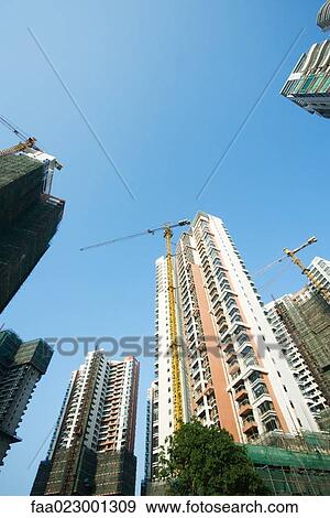 China, Guangdong Province, Guangzhou, high rises under construction View Large Photo Image Stock Photo - China, Guangdong Province, Guangzhou, high rises under construction. Fotosearch