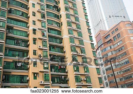 China, Guangdong Province, Guangzhou, high rise apartment building with green glass windows View Large Photo Image Stock Photography - China, Guangdong Province, Guangzhou, high rise apartment building with green glass windows. Fotosearch