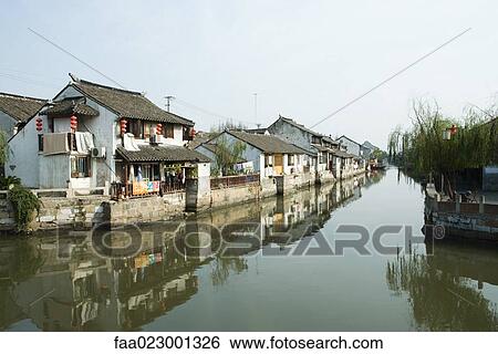 China, Guangdong Province, houses along canal View Large Photo Image Stock Photograph - China, Guangdong Province, houses along canal. Fotosearch