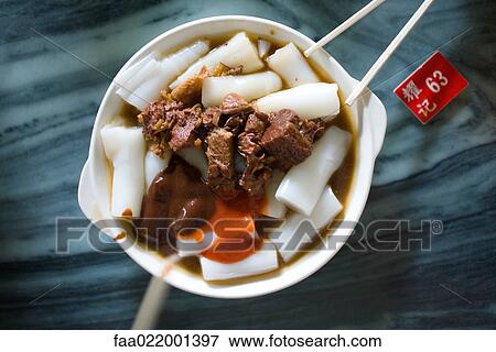 Stock Photo - Chinese dish on table next to table marker. Fotosearch