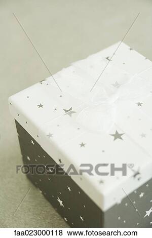 Christmas gift, on floor, close-up View Large Photo Image Stock Photo - Christmas gift, on floor, close-up. Fotosearch