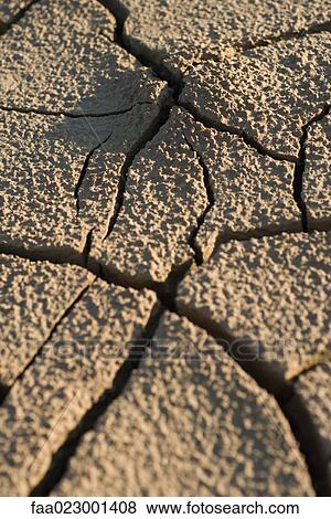 Stock Photo - Cracked dry soil, full frame. Fotosearch