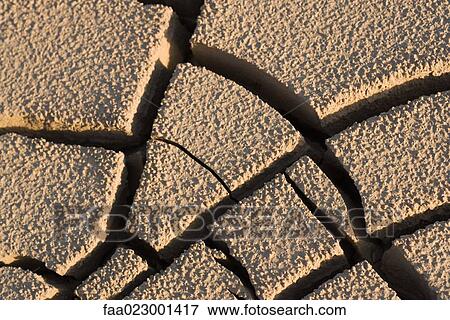 Cracked dry soil, full frame View Large Photo Image Stock Photo - Cracked dry soil, full frame. Fotosearch