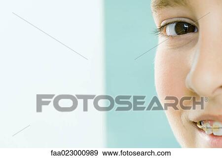Cropped view of boy smiling at camera, portrait View Large Photo Image Stock Photo - Cropped view of boy smiling at camera, portrait. Fotosearch