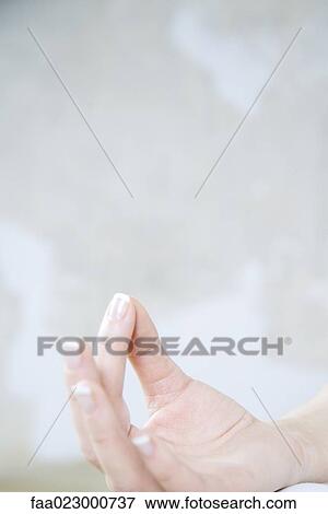 Cropped view of woman's hand, forefinger touching thumb View Large Photo Image Stock Photo - Cropped view of woman's hand, forefinger touching thumb. Fotosearch
