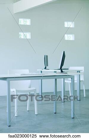 Desktop computers on desks in office View Large Photo Image Stock Photography - Desktop computers on desks in office. Fotosearch