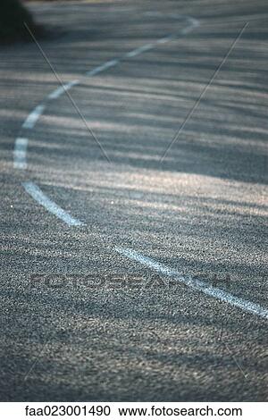 Dividing line on asphalt, close-up View Large Photo Image Stock Image - Dividing line on asphalt, close-up. Fotosearch