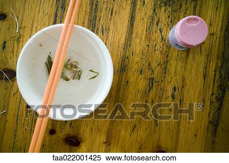 Fish bones on table next to bowl with chopsticks View Large Photo Image Stock Photography - Fish bones on table next to bowl with chopsticks. Fotosearch