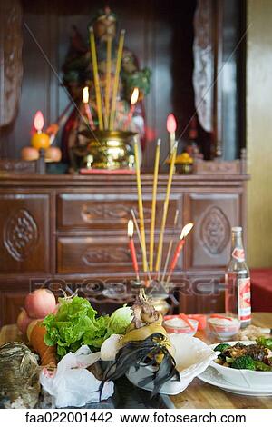 Food, incense and candles on table as religious offering View Large Photo Image Stock Image - Food, incense and candles on table as religious offering. Fotosearch