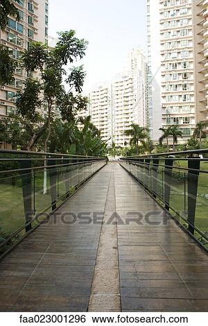 Footbridge in apartment complex park View Large Photo Image Stock Photograph - Footbridge in apartment complex park. Fotosearch