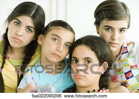 Four young female friends looking glum, portrait View Large Photo Image Stock Photograph - Four young female friends looking glum, portrait. Fotosearch