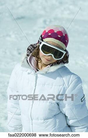 Stock Photo - Girl dressed in ski gear, portrait. Fotosearch
