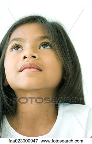 Girl looking up, smiling, portrait View Large Photo Image Stock Photo - Girl looking up, smiling, portrait. Fotosearch