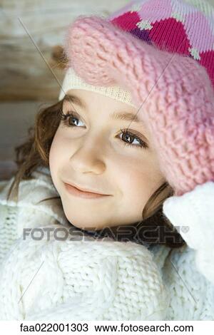 Girl shading eyes with mittened hand, looking away, portrait View Large Photo Image Stock Image - Girl shading eyes with mittened hand, looking away, portrait. Fotosearch