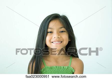 Girl smiling at camera, portrait View Large Photo Image Stock Image - Girl smiling at camera, portrait. Fotosearch