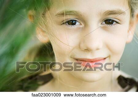 Girl smiling at camera, portrait View Large Photo Image Stock Photo - Girl smiling at camera, portrait. Fotosearch