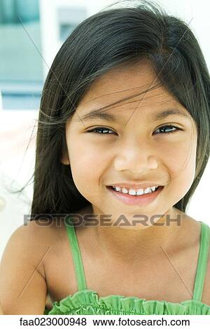 Girl smiling at camera, tousled hair, portrait View Large Photo Image Stock Photo - Girl smiling at camera, tousled hair, portrait. Fotosearch