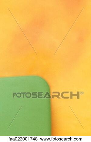 Green object against yellow background, close-up View Large Photo Image Stock Photo - Green object against yellow background, close-up. Fotosearch