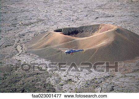 Helicopter hovering above crater, Reunion View Large Photo Image Stock Photo - Helicopter hovering above crater, Reunion. Fotosearch