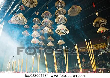 Picture - Incense burning in Chinese temple, low angle view. Fotosearch