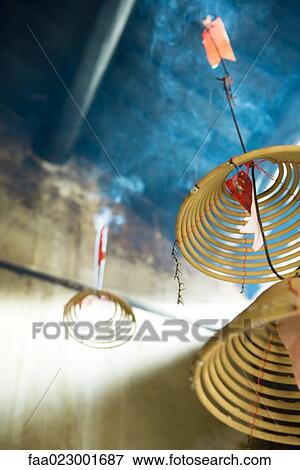 Incense burning in Chinese temple, low angle view, close-up View Large Photo Image Stock Photo - Incense burning in Chinese temple, low angle view, close-up. Fotosearch