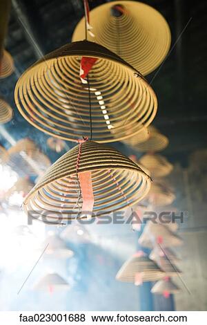 Incense burning in Chinese temple, low angle view, close-up View Large Photo Image Stock Photo - Incense burning in Chinese temple, low angle view, close-up. Fotosearch