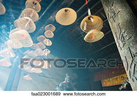 Incense burning in Chinese temple, low angle view View Large Photo Image Stock Photo - Incense burning in Chinese temple, low angle view. Fotosearch