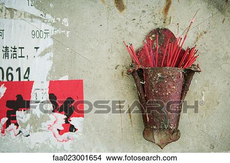 Incense burning in holder on wall View Large Photo Image Picture - Incense burning in holder on wall. Fotosearch