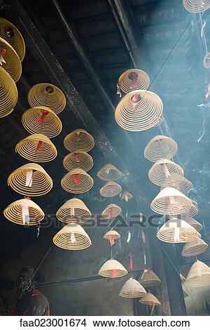 Incense hanging from ceiling in Chinese temple View Large Photo Image Picture - Incense hanging from ceiling in Chinese temple. Fotosearch