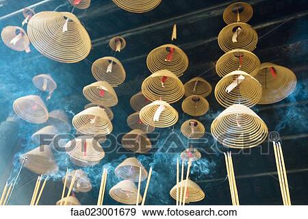 Incense hanging from ceiling in Chinese temple, low angle view View Large Photo Image Stock Photo - Incense hanging from ceiling in Chinese temple, low angle view. Fotosearch