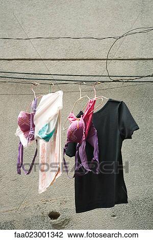 Laundry hanging on cable View Large Photo Image Stock Image - Laundry hanging on cable. Fotosearch