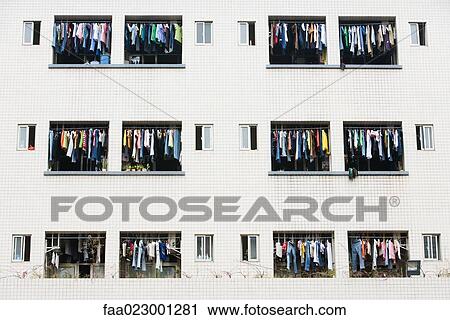 Laundry hanging to dry in balconies of apartment building View Large Photo Image Stock Image - Laundry hanging to dry in balconies of apartment building. Fotosearch