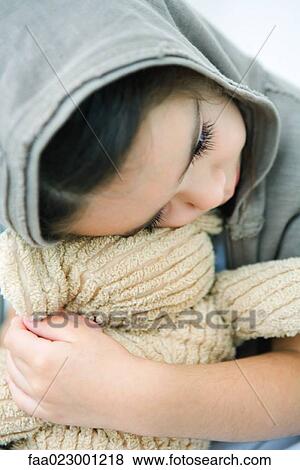 Little girl resting head on teddy bear, close-up View Large Photo Image Stock Photo - Little girl resting head on teddy bear, close-up. Fotosearch