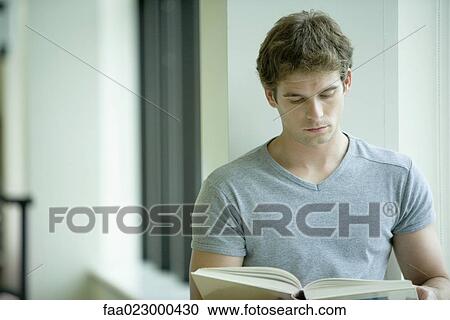 Male college student studying in library View Large Photo Image Stock Image - Male college student studying in library. Fotosearch