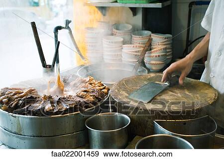 Man cooking at outside stand, China View Large Photo Image Stock Photo - Man cooking at outside stand, China. Fotosearch