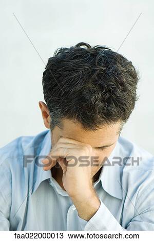 Man leaning head against fist, portrait View Large Photo Image Stock Image - Man leaning head against fist, portrait. Fotosearch