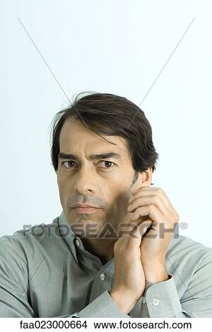 Man looking at camera, portrait View Large Photo Image Picture - Man looking at camera, portrait. Fotosearch