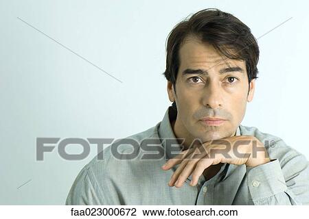 Man looking at camera, portrait View Large Photo Image Stock Image - Man looking at camera, portrait. Fotosearch