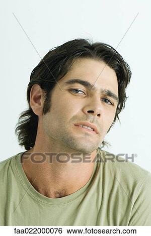 Man looking at camera, portrait View Large Photo Image Stock Photograph - Man looking at camera, portrait. Fotosearch