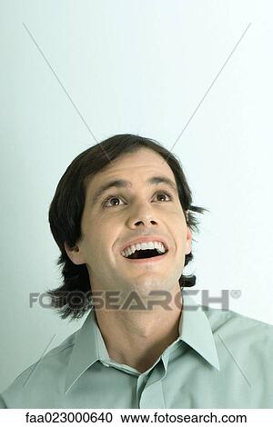Man looking up, mouth wide open, smiling, portrait View Large Photo Image Stock Image - Man looking up, mouth wide open, smiling, portrait. Fotosearch