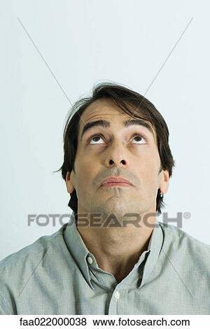 Man looking up, portrait View Large Photo Image Stock Photo - Man looking up, portrait. Fotosearch