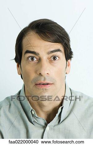 Man making surprised face, portrait View Large Photo Image Stock Image - Man making surprised face, portrait. Fotosearch