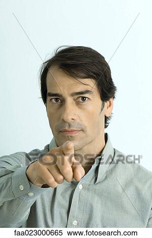 Man pointing at camera, portrait View Large Photo Image Stock Photography - Man pointing at camera, portrait. Fotosearch